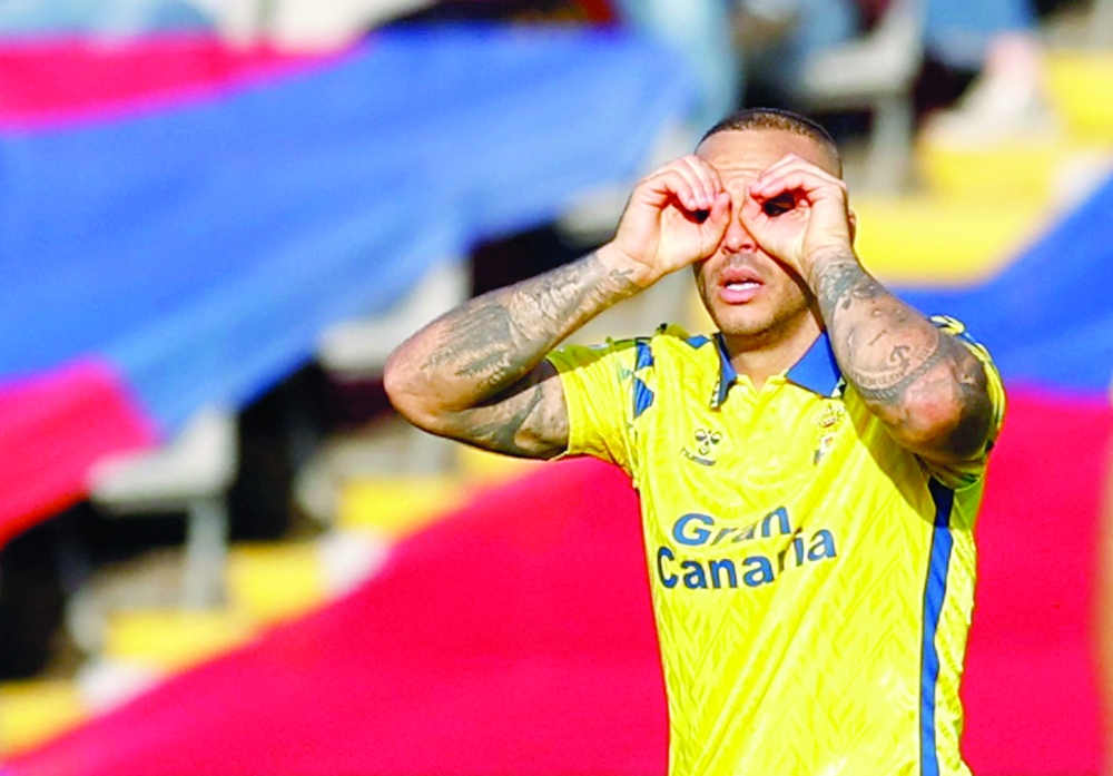 Las Palmas' Sandro Ramirez celebrates scoring first goal. — Reuters