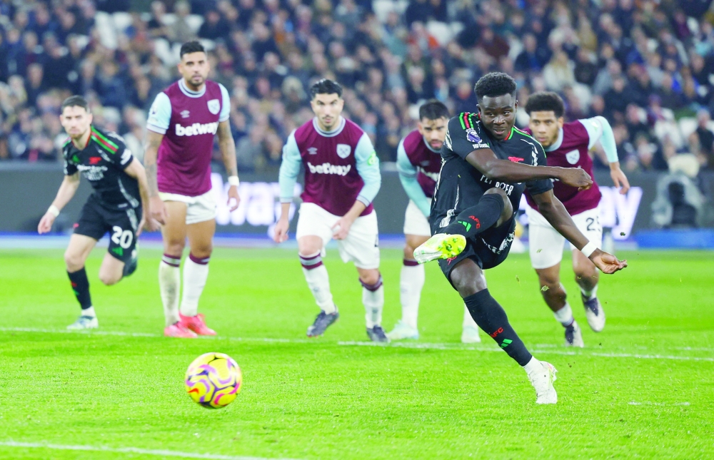 Arsenal's Bukayo Saka scores their fifth goal. — Reuters