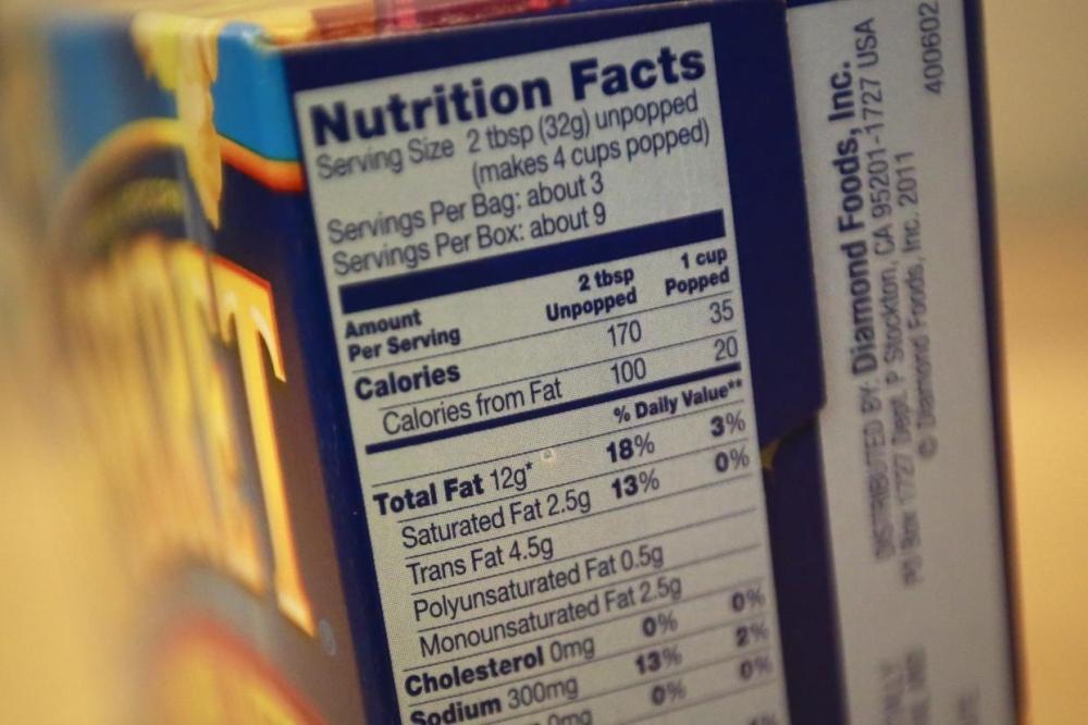 Nutrition facts are seen on a popcorn box, in this illustration image. — Reuters