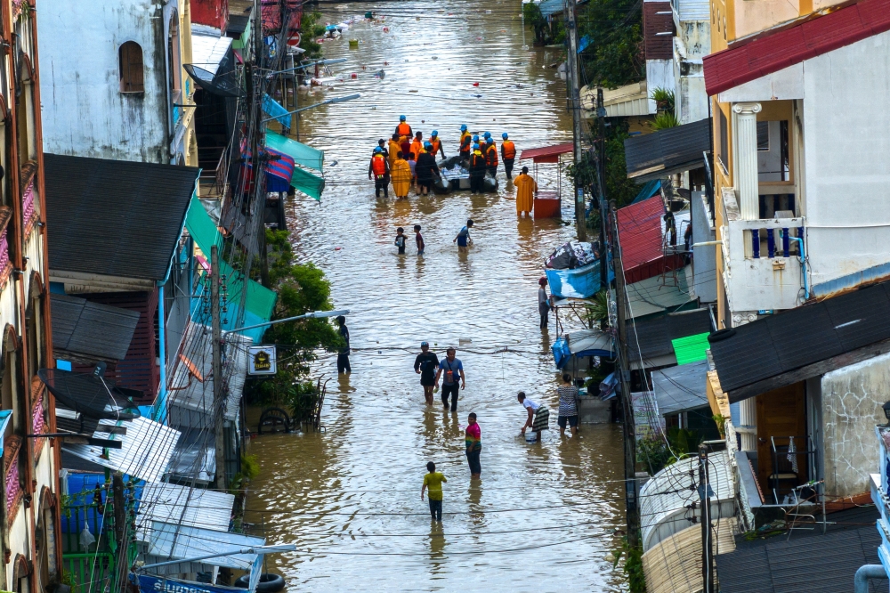 A drone view shows people wading through a flooded area in Hat Yai district, Songkhla province, Thailand. — Reuters 