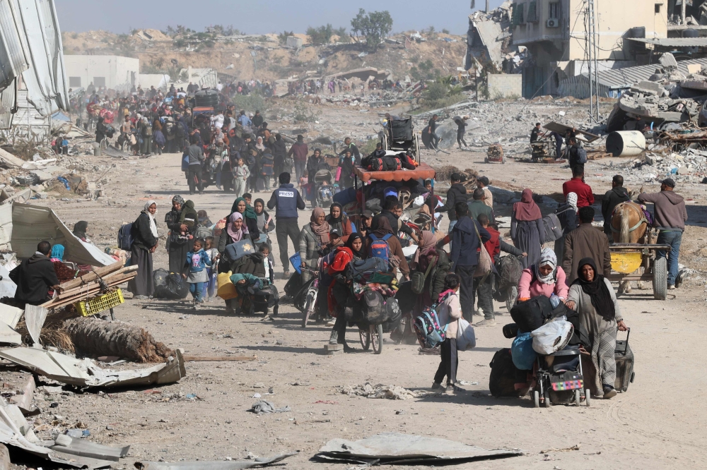 Palestinians, displaced from Beit Lahia, arrive in Jabalia in the northern Gaza Strip. — AFP 