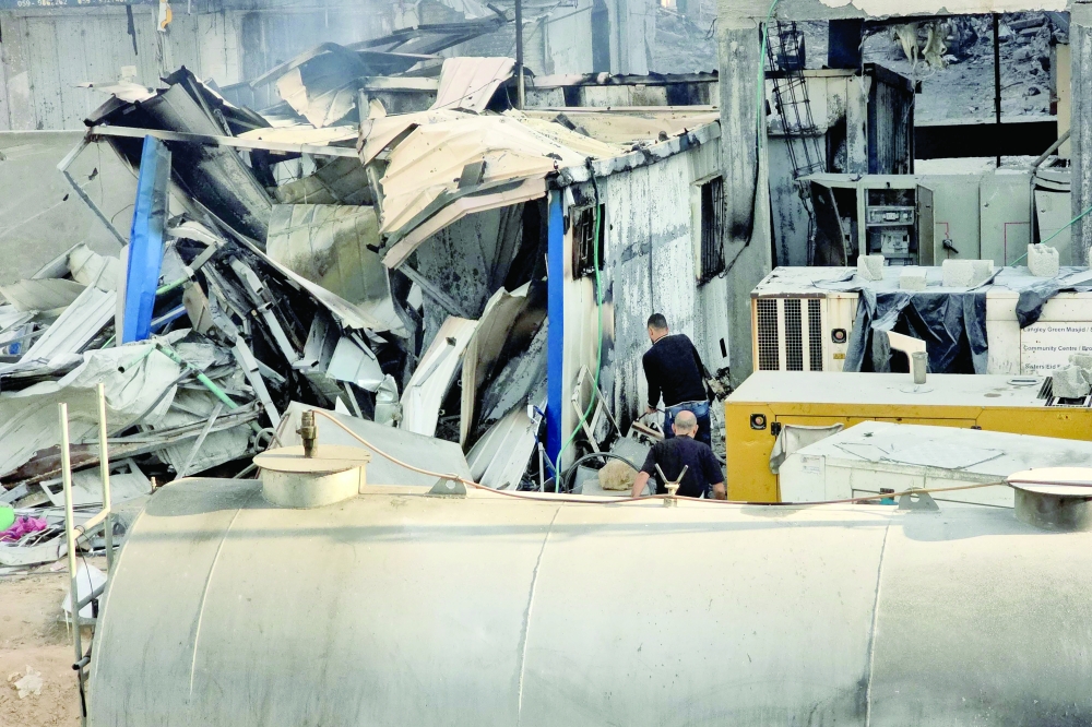 People check the damage outside the Kamal Adwan hospital in Beit Lahya in the northern Gaza Strip, following a reported Israeli strike that hit the medical complex. — AFP