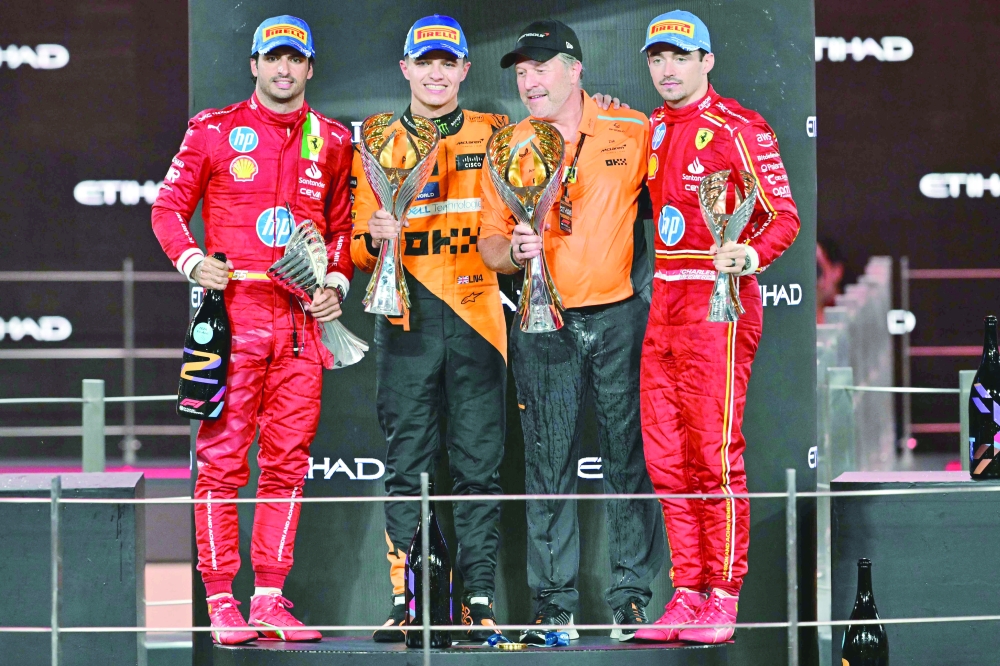 (From L) Ferrari's Carlos Sainz, McLaren's Norris, McLaren's Zak Brown and  Leclerc. — AFP