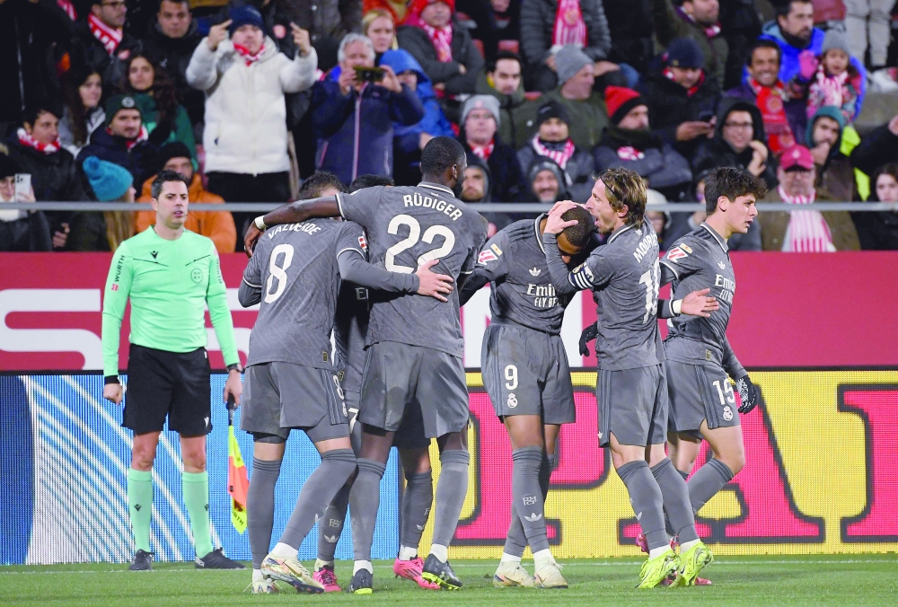 Real Madrid's Kylian Mbappe (3R) celebrates scoring third goal. —  AFP