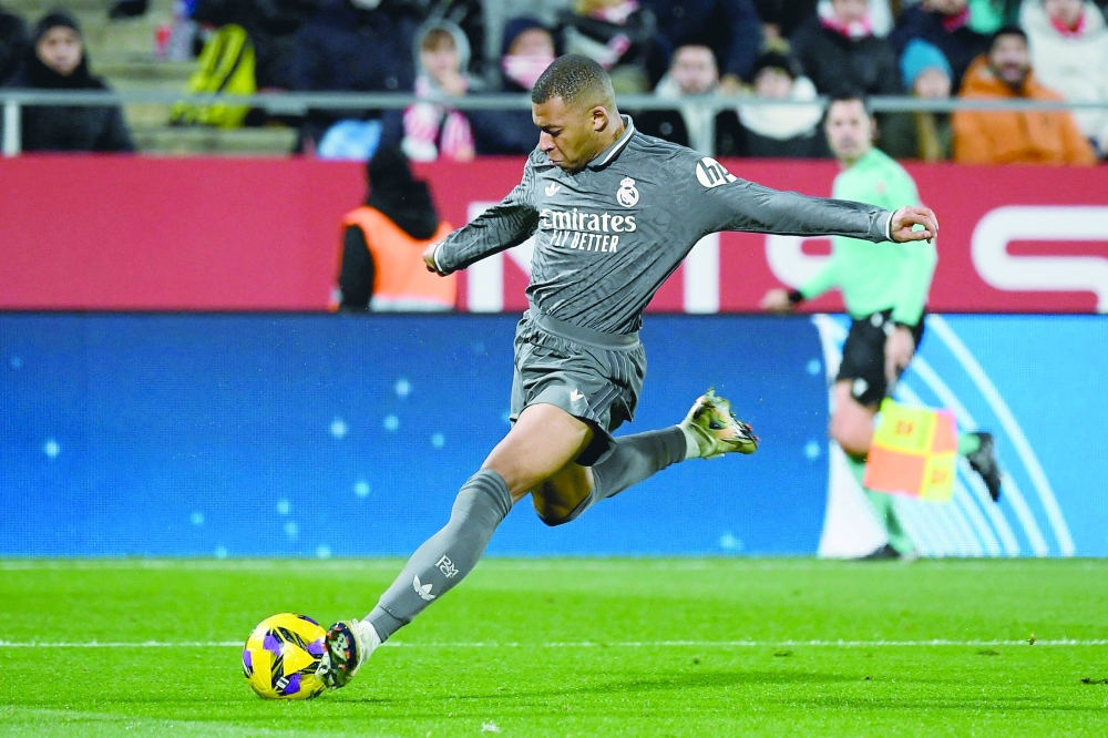 Real Madrid's French forward #09 Kylian Mbappe scores third goal. — AFP