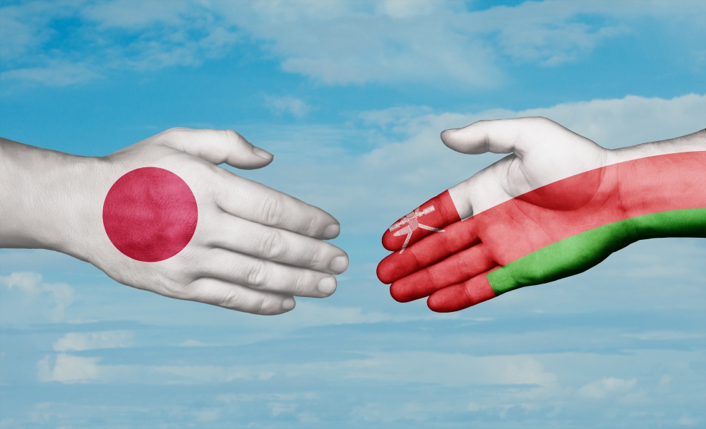 Oman,And,Japan,Country,Handshaking,With,Flags,,Consensus,Concept,International