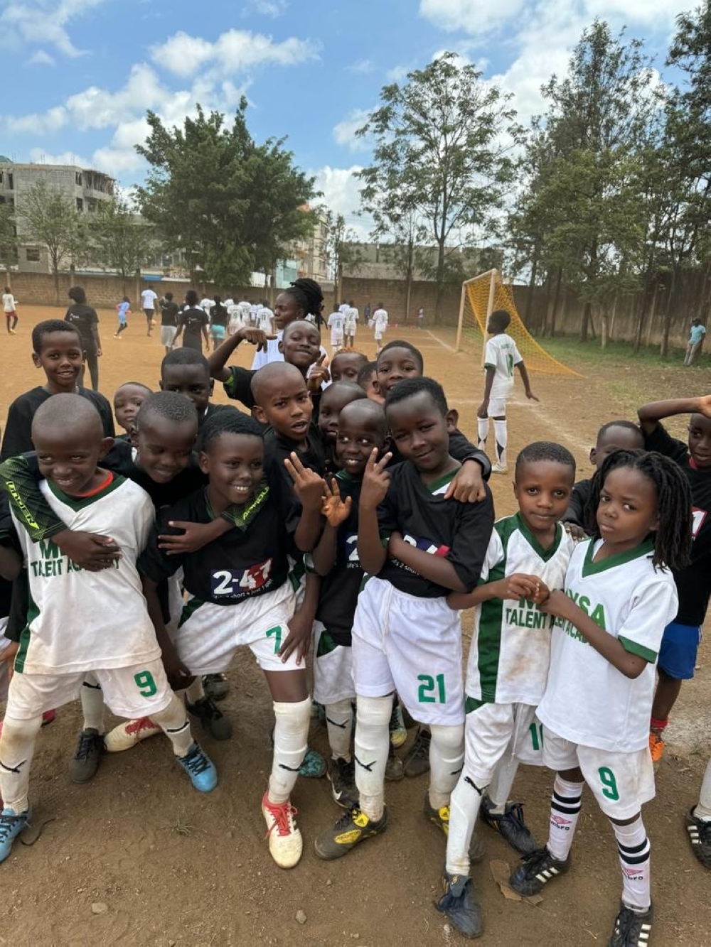 A collective effort as children during a sports event organised by Wellness for Greatness Kenya which foster healthy habits and community engagement