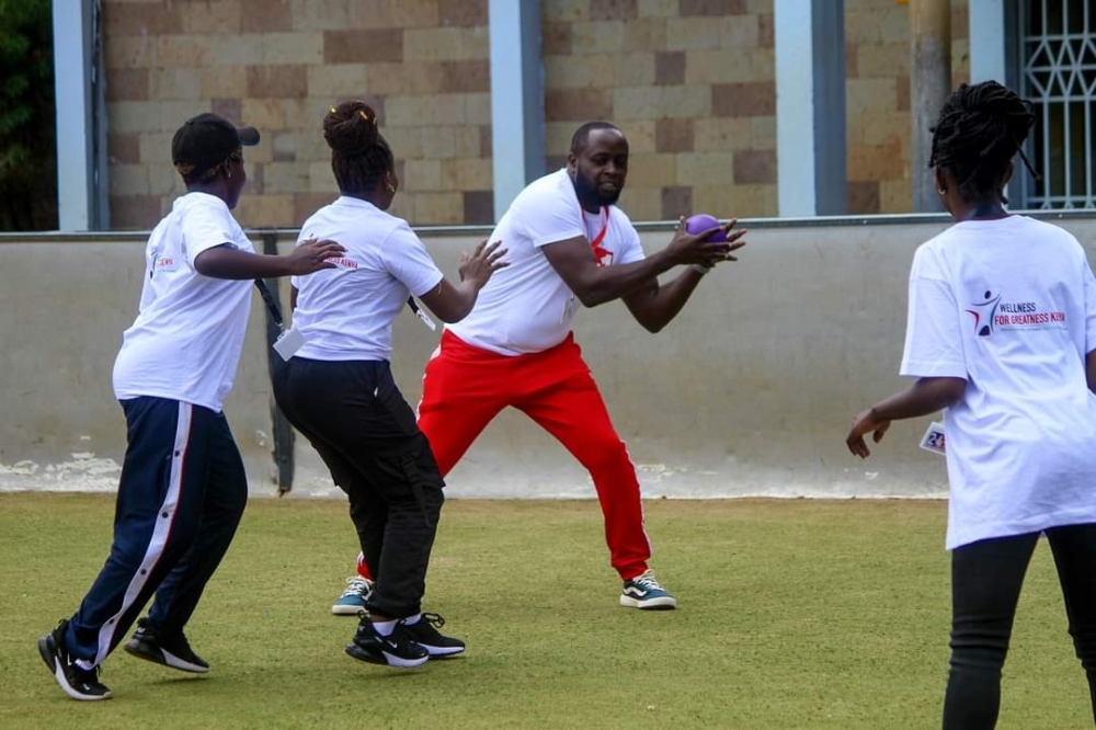 Young athletes from the community gather in solidarity at a Wellness for Greatness Kenya football event