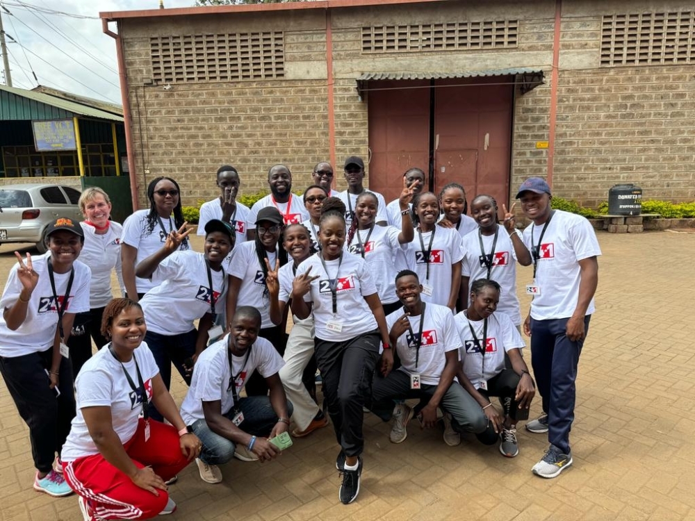 Building community bonds as members of Wellness for Greatness Kenya engage with young participants during a sports activation event