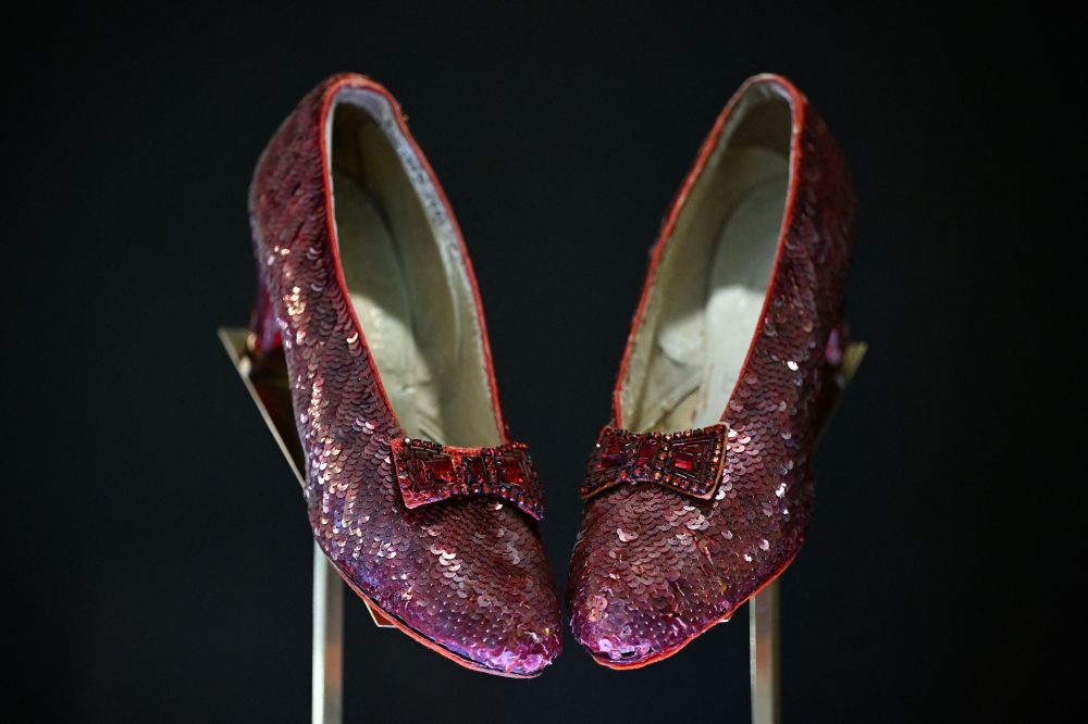 (FILES) The ruby slippers worn by US actress and singer Judy Garland in the 1939 film The Wizard of Oz are pictured on display in London on November 27, 2024. Dorothy痴 ruby slippers sold at auction on December 7, 2024 for $32.5 million. (Photo by Justin TALLIS / AFP)

