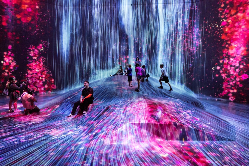 Visitors at teamLab Borderless at the Mori Building Digital Art Museum in Tokyo, Oct. 4, 2024. (Shiho Fukada/The New York Times)