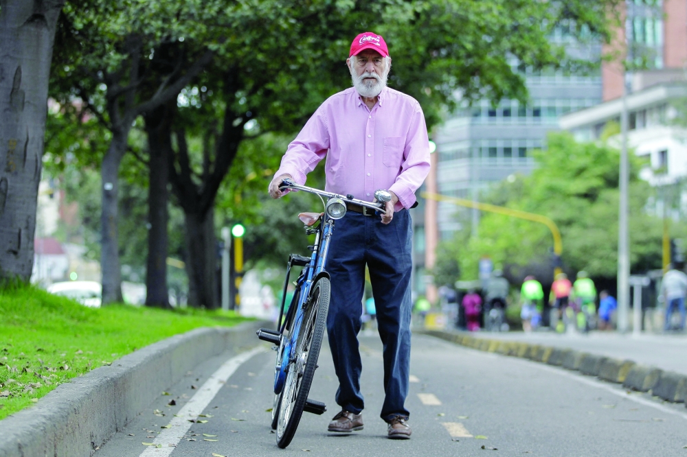 Jaime Ortiz Marino, founder of Ciclovia, during a weekly car-free day in Bogota. — AFP