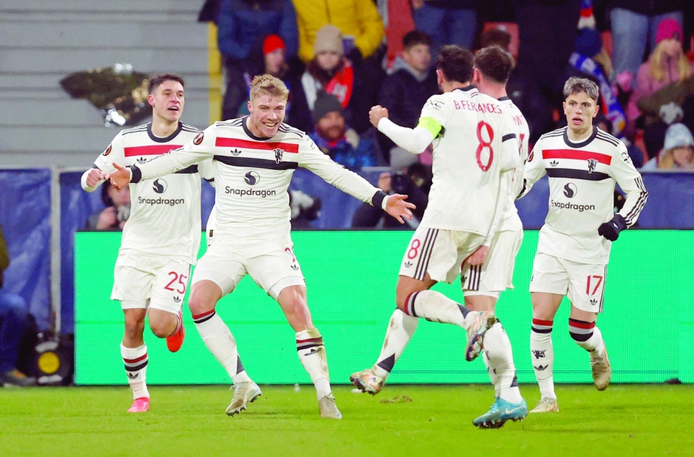 Soccer Football - Europa League - Viktoria Plzen v Manchester United - Doosan Arena, Plzen, Czech Republic - December 12, 2024 Manchester United's Rasmus Hojlund celebrates scoring their second goal with teammates REUTERS/David W Cerny