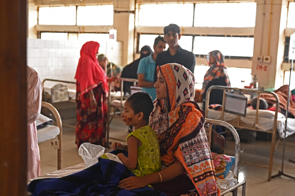 A woman ) rests at the infectious diseases hospital in Dhaka, after she was bitten by a jackal. 