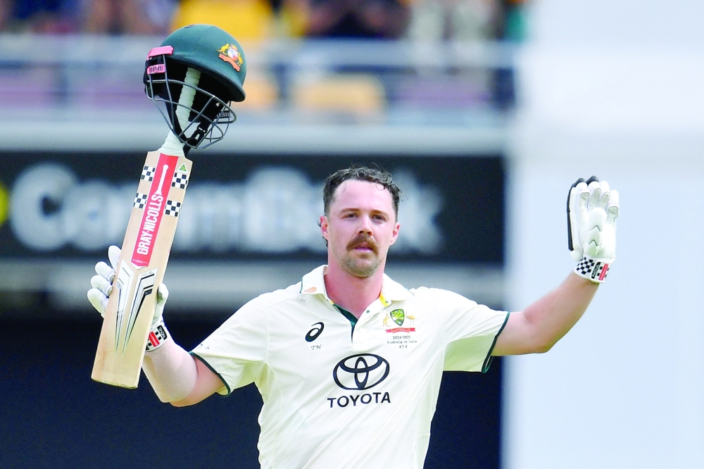 Australia's Travis Head celebrates after reaching his century. — Reuters 