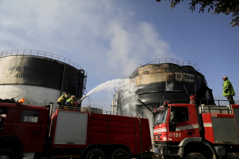 Fire fighters extinguish fire at a power station following Israeli airstrikes in Sanaa, Yemen December 19, 2024. 
