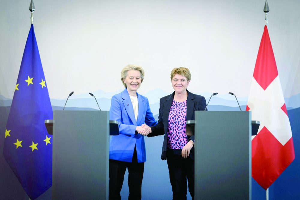 Swiss President Viola Amherd (L) shakes hands with European Commission President Ursula von der Leyen after a statement in Bern. — AFP
