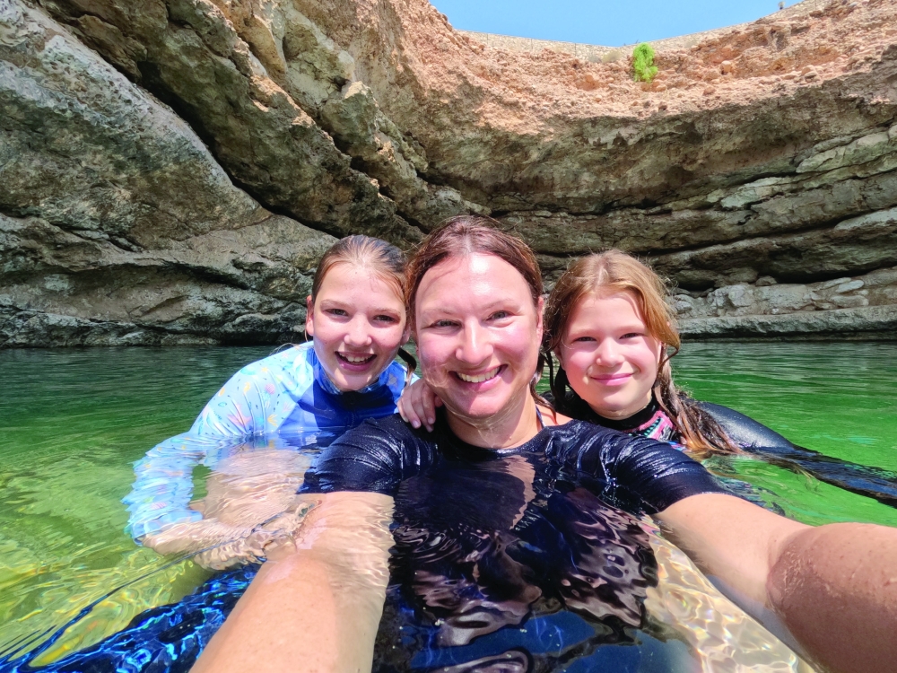 Claire Hall with her daughters at Bimmah Sinkhole