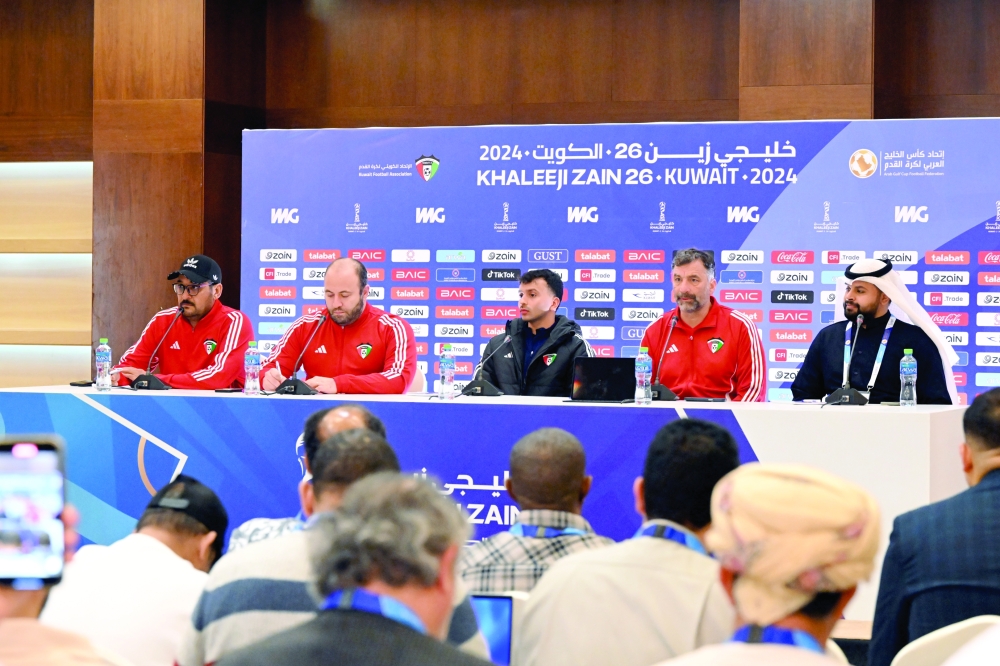 Kuwait head coach Rui Bento and player Mubarak Al Fane attend the press conference. — Hussain Al Maqbali