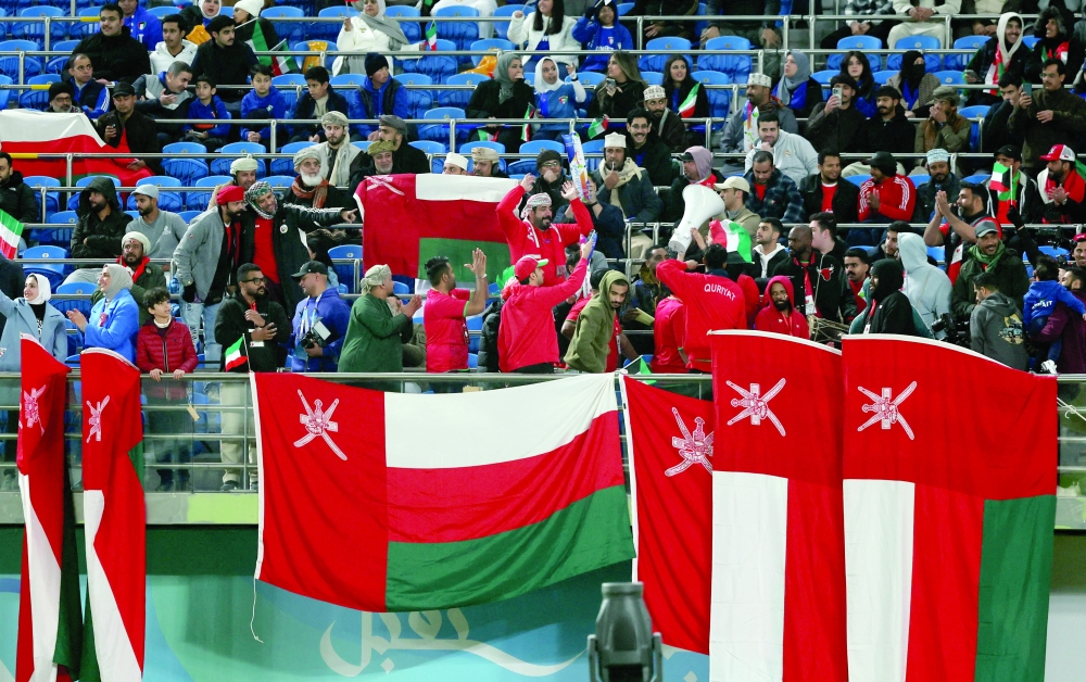 Gulf Cup - Group A - Kuwait v Oman: Oman fans with flags inside the stadium before the match REUTERS
