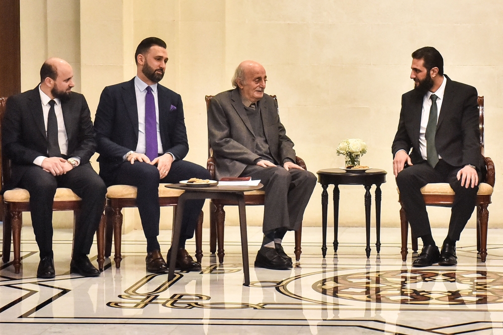 Walid Jumblatt (C), the former leader of Lebanon's Progressive Socialist Party (PSP), and his son and current party head Taymur Jumblatt (C-L) meet with Syrian leader Ahmed al-Sharaa (R) and interim prime minister Mohammad al-Bashir (L) during a visit to Damascus. — AFP 