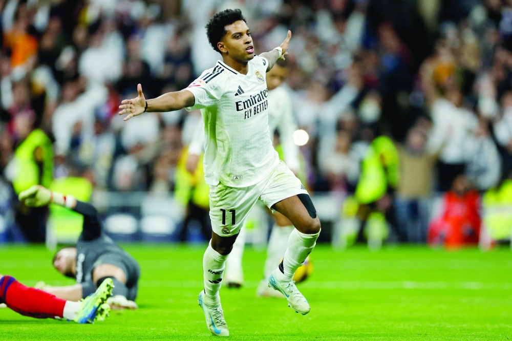  Rodrygo celebrates scoring his team's third goal/ AFP)