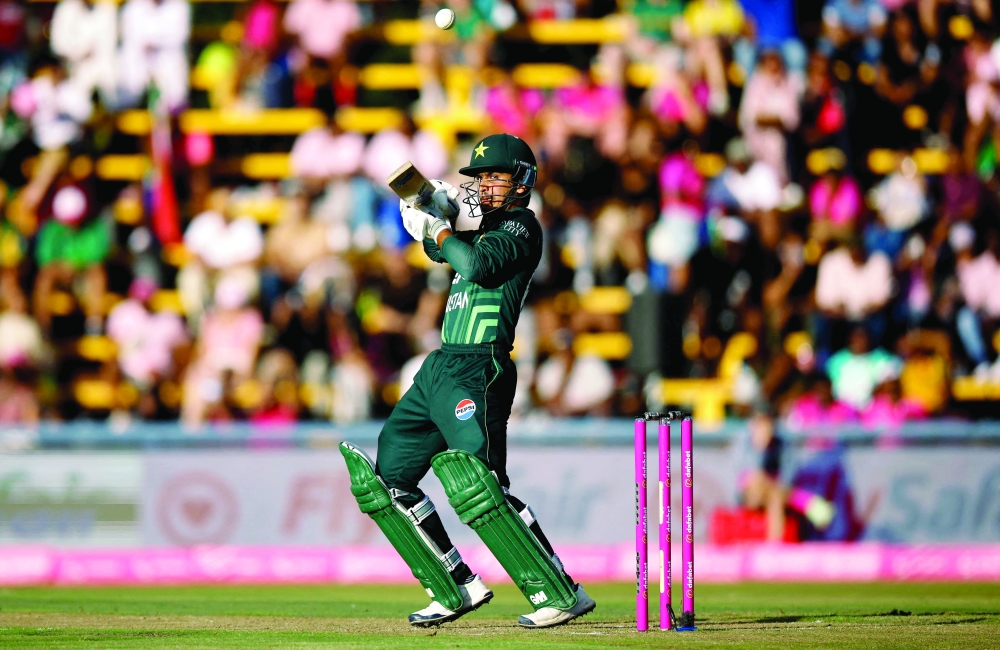 Pakistan's Saim Ayub plays a shot during the third one day international (ODI) cricket match between South Africa and Pakistan at The Wanderers Stadium in Johannesburg on December 22, 2024. (Photo by PHILL MAGAKOE / AFP)