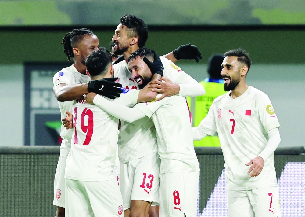 Soccer Football - Gulf Cup - Group B - Saudi Arabia v Bahrain - Jaber Al Ahmad International Stadium, Kuwait City, Kuwait - December 22, 2024. Bahrain's Mohammed Marhoon celebrates scoring their third goal with teammates. — Reuters/Mohamed Abd El Ghany