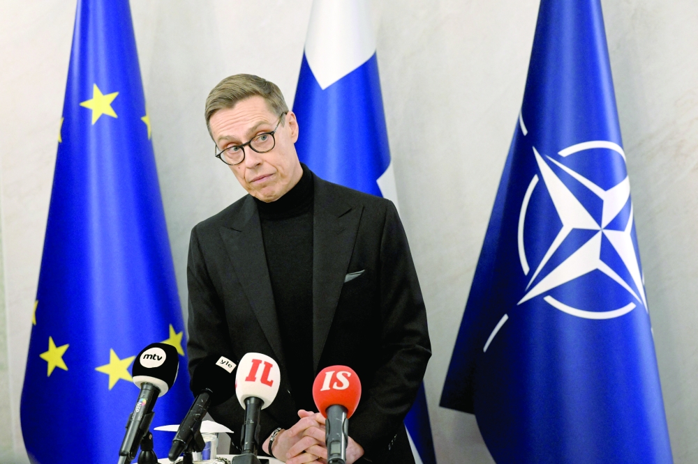 Finnish President Alexander Stubb addresses journalists at the Presidential Palace in Helsinki. — AFP