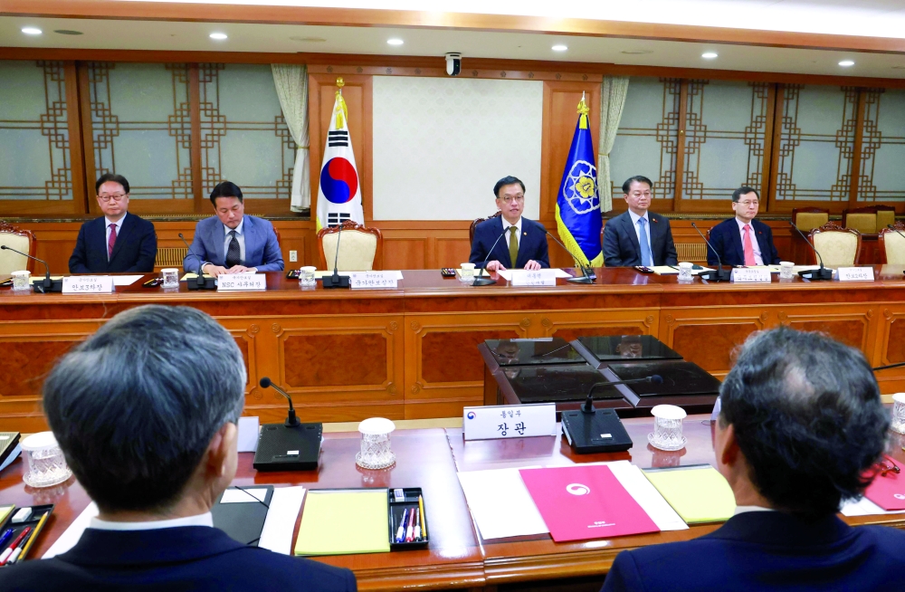 South Korea's Finance Minister and new acting president Choi Sang-mok (C) speaks as he presides over a meeting of the National Security Council at the Government Complex in Seoul. — AFP