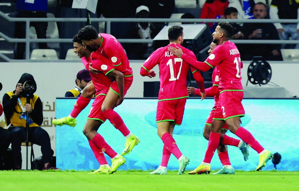 Soccer Football - Gulf Cup - Group A - United Arab Emirates v Oman - Jaber Al-Mubarak Al-Hamad Stadium, Kuwait City, Kuwait - December 27, 2024 Oman's Abdulrahman Al-Mushaifri celebrates with teammates after scoring their first goal REUTERS/Mohamed Abd El Ghany
