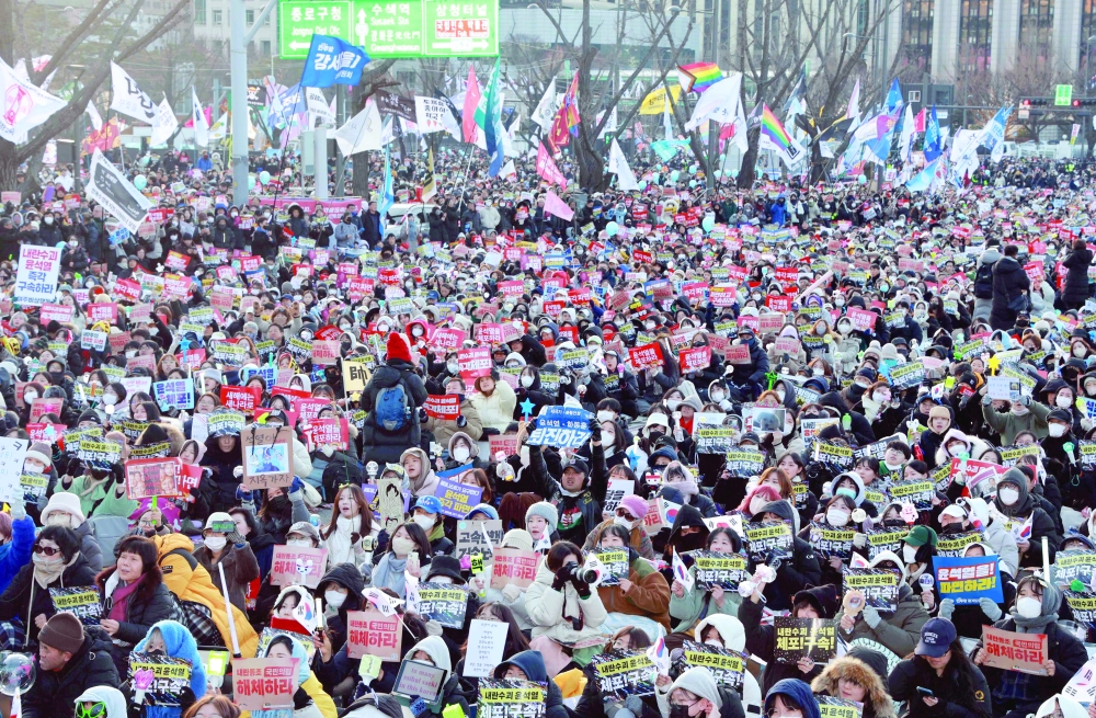 Protesters take part in a rally calling for the ouster of South Korea's impeached President Yoon Suk Yeol in front of the Gwanghwamun Gate of Gyeongbokgung Palace in Seoul. — AFP 