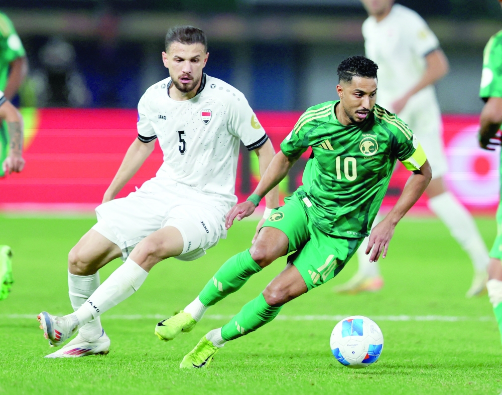 Soccer Football - Gulf Cup - Group B - Iraq v Saudi Arabia - Jaber Al-Ahmad International Stadium, Kuwait City, Kuwait - December 28, 2024  Saudi Arabia's Salem Al Dawsari in action with Iraq's Ali Atiyah REUTERS/Mohamed Abd El Ghany
