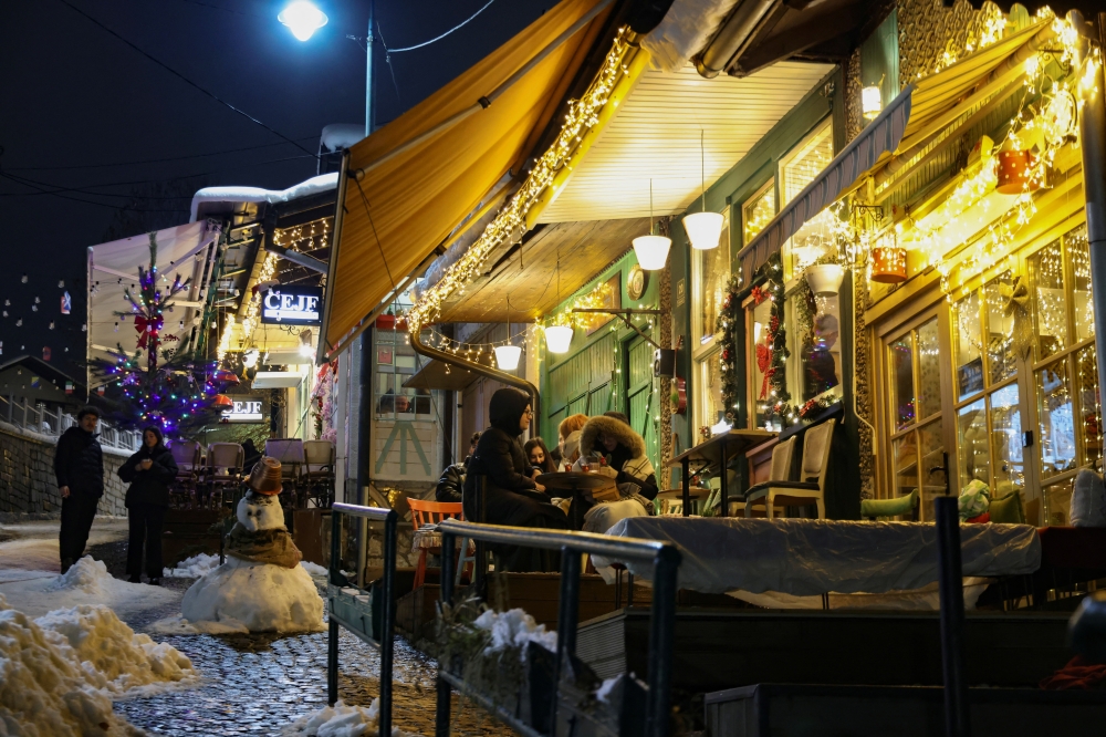 Customers, at a small cafe, listen to the traditional love song Sevdalinka, in Sarajevo, Bosnia and Herzegovina, December 27, 2024. REUTERS/Amel Emric
