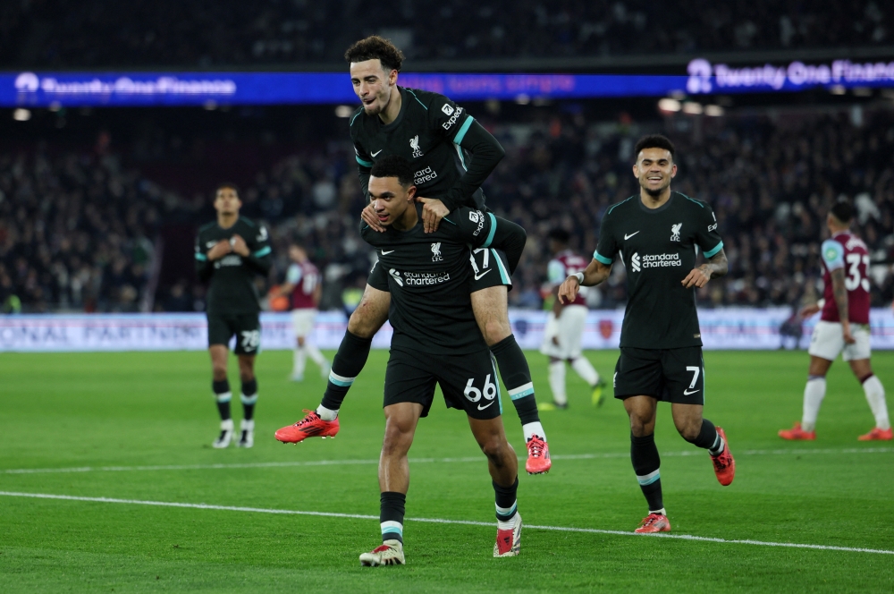 Liverpool's Trent Alexander-Arnold celebrates scoring their fourth goal 