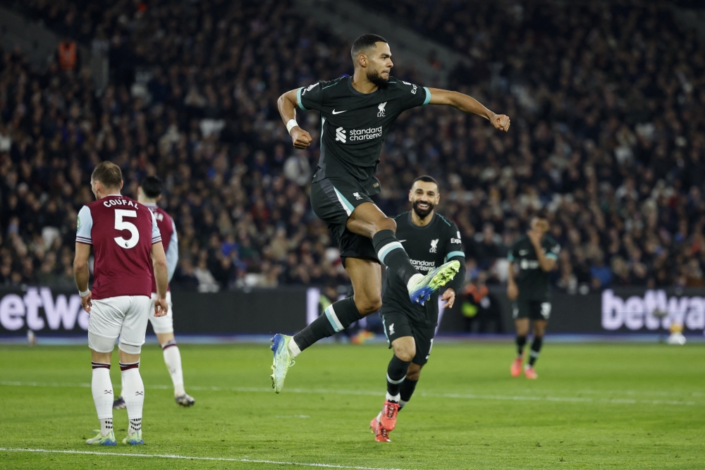 Liverpool's Cody Gakpo celebrates scoring their second goal  