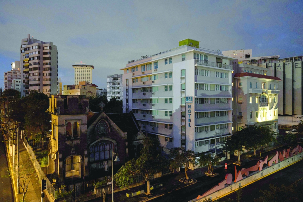 Residential buildings and a hotel are seen in the dark in San Juan, Puerto Rico, after a major power outage hit the island. Puerto Rico woke up in darkness on Tuesday morning, after a power grid failure left nearly all of the island without electricity. Around 90% of clients on the island were without power at 9 am local time. — Agencies