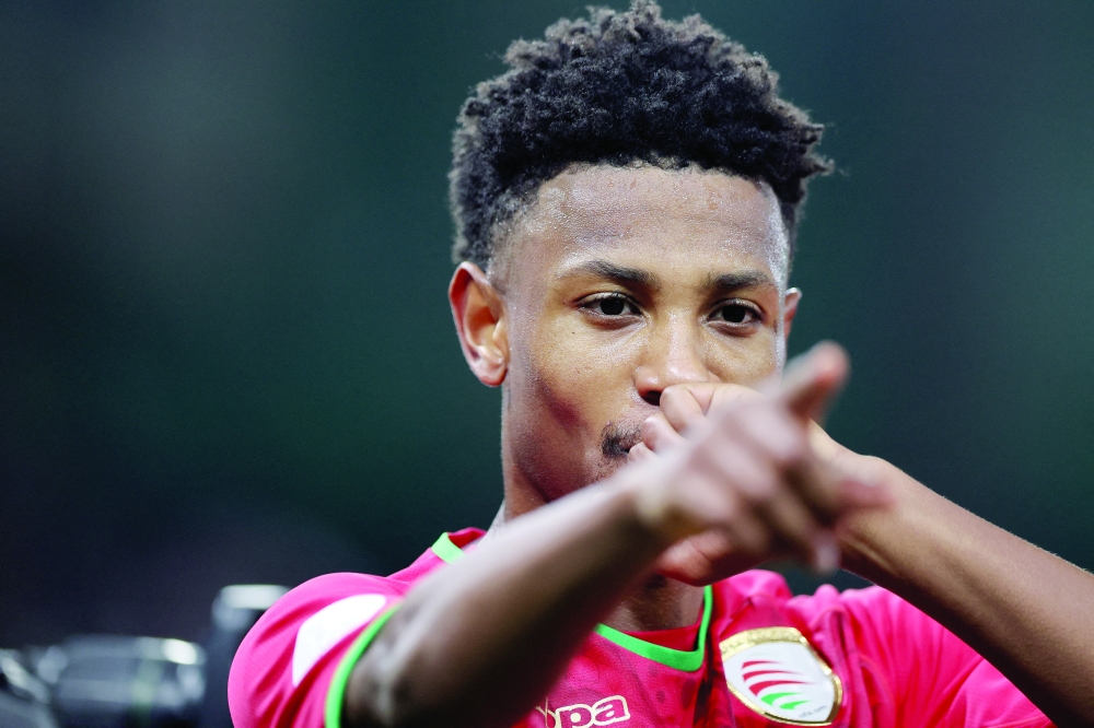 Oman's Arshad al Alawi celebrates scoring their first goal REUTERS/Mohamed Abd El Ghany