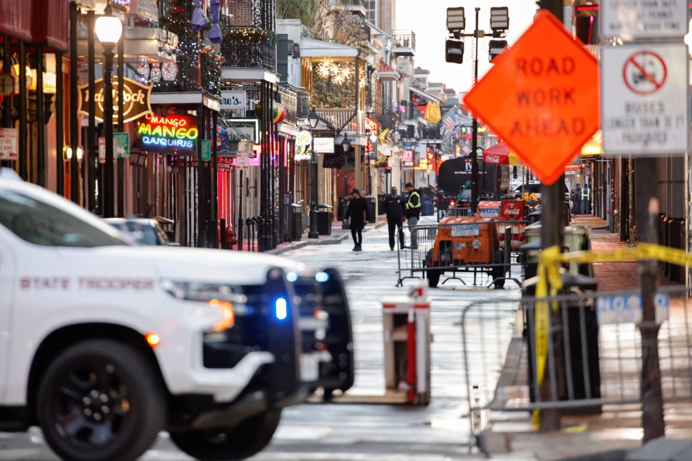 Law enforcement members work at the site where people were killed by a man driving a truck in an attack during New Year's celebrations in New Orleans. - Reuters