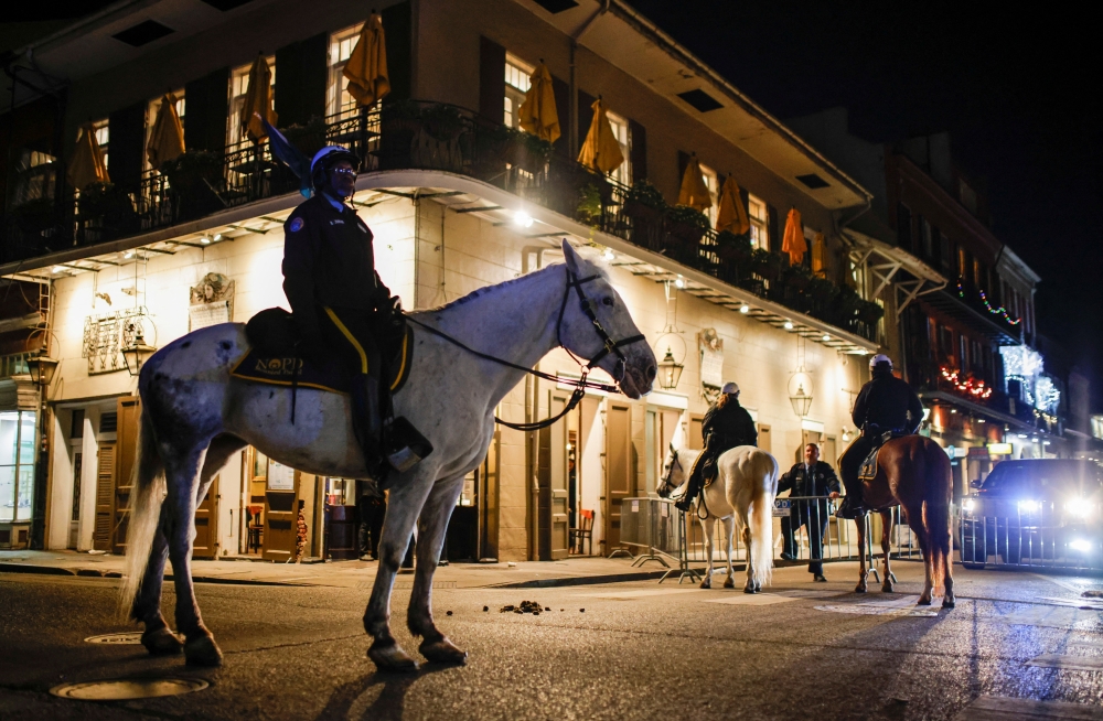 Police officers sit on horses near the site where people were killed by a man driving a truck in an attack during New Year's celebrations in New Orleans. - Reuters