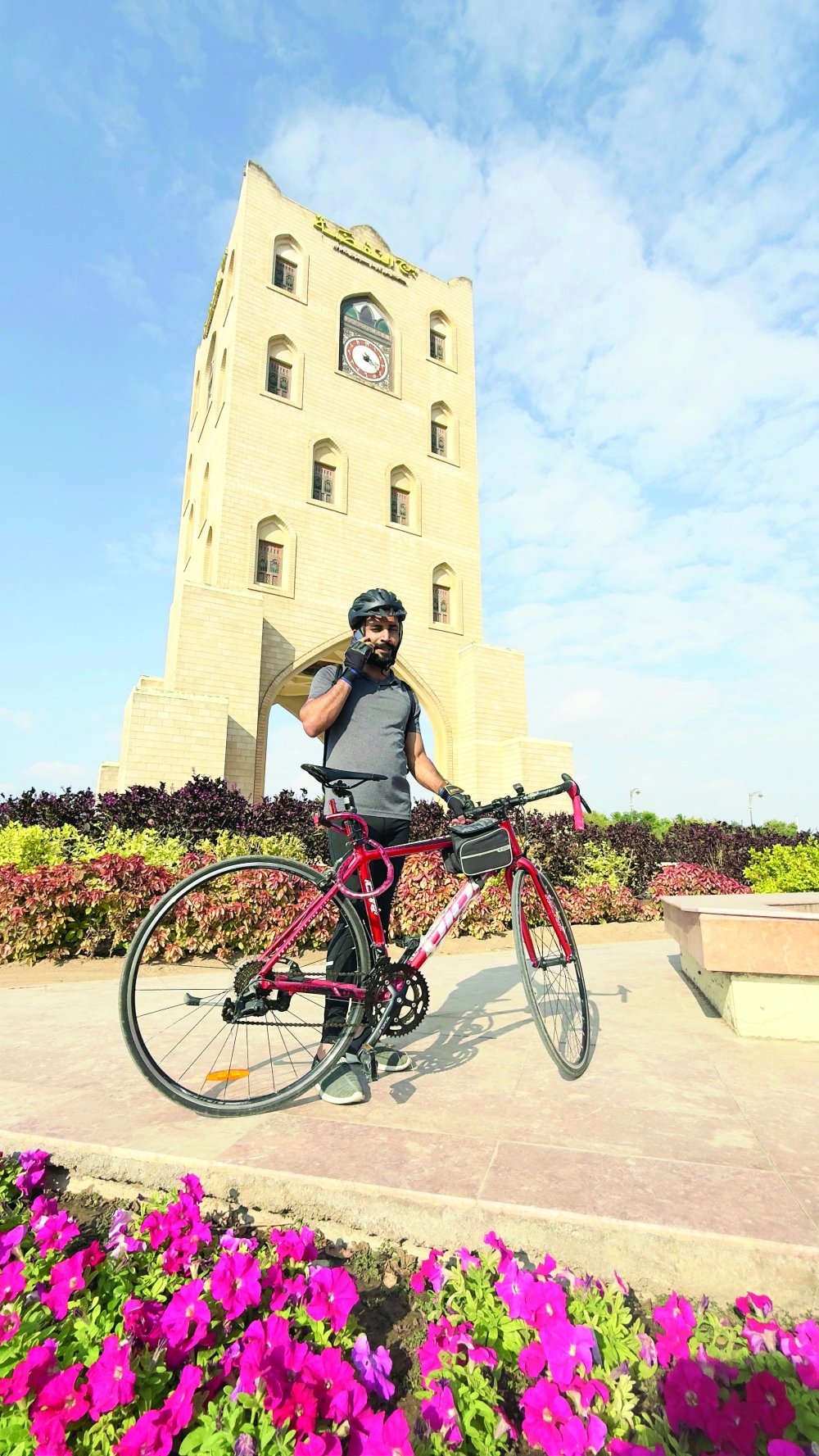 Arun Thadagath posing in front of the iconic Clock Tower Salalah
