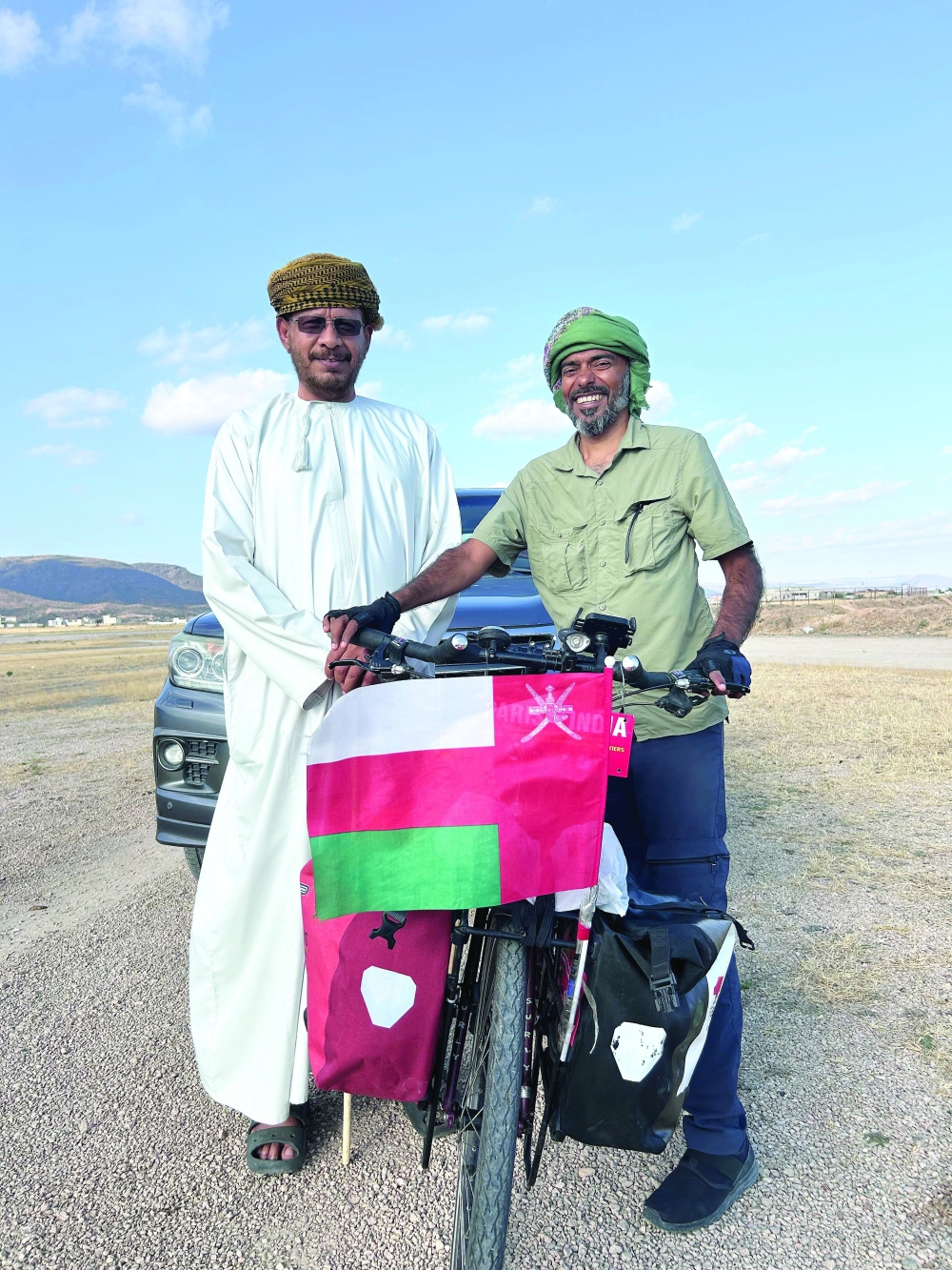 Cyclist Arun Thadagath with an Omani in Salalah