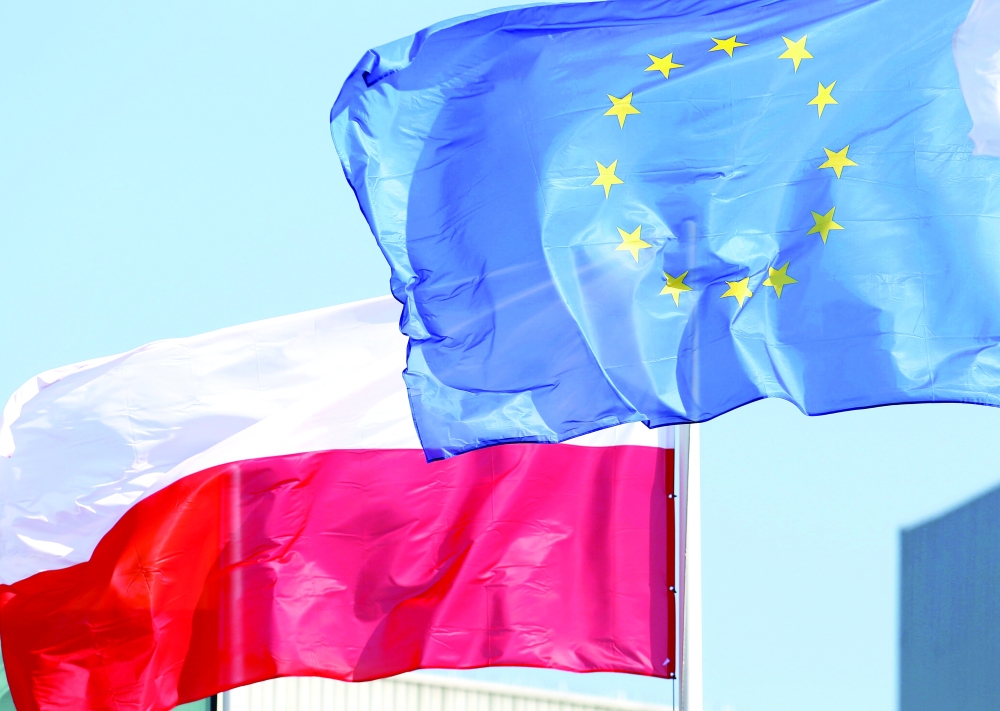European Union and Polish flags flutter. — Reuters