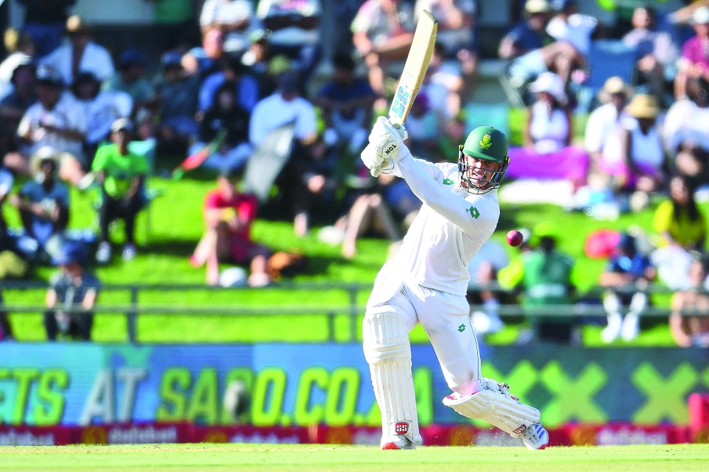 TOPSHOT — South Africa's Ryan Rickelton watches the ball after playing a shot during the first day of the second international Test cricket match between South Africa and Pakistan at Newlands stadium in Cape Town on January 3, 2025. (Photo by Rodger Bosch / AFP)