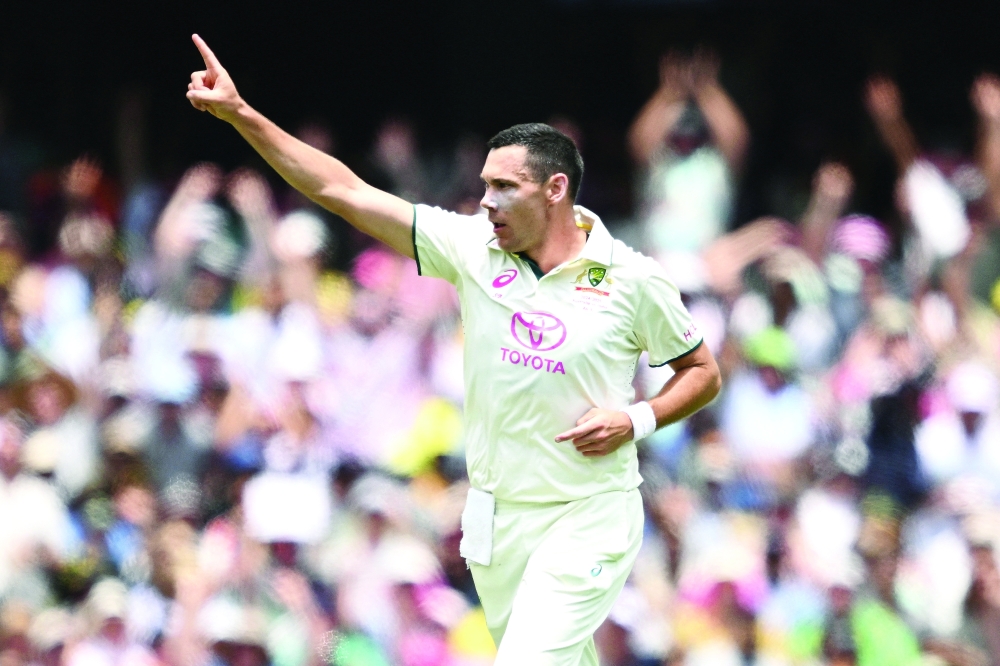 Cricket — Fifth Test — Australia v India — Sydney Cricket Ground, Sydney, Australia — January 3, 2025 Australia's Scott Boland celebrates taking the wicket of India's Virat Kohli DAN HIMBRECHTS/AAP Image via REUTERS