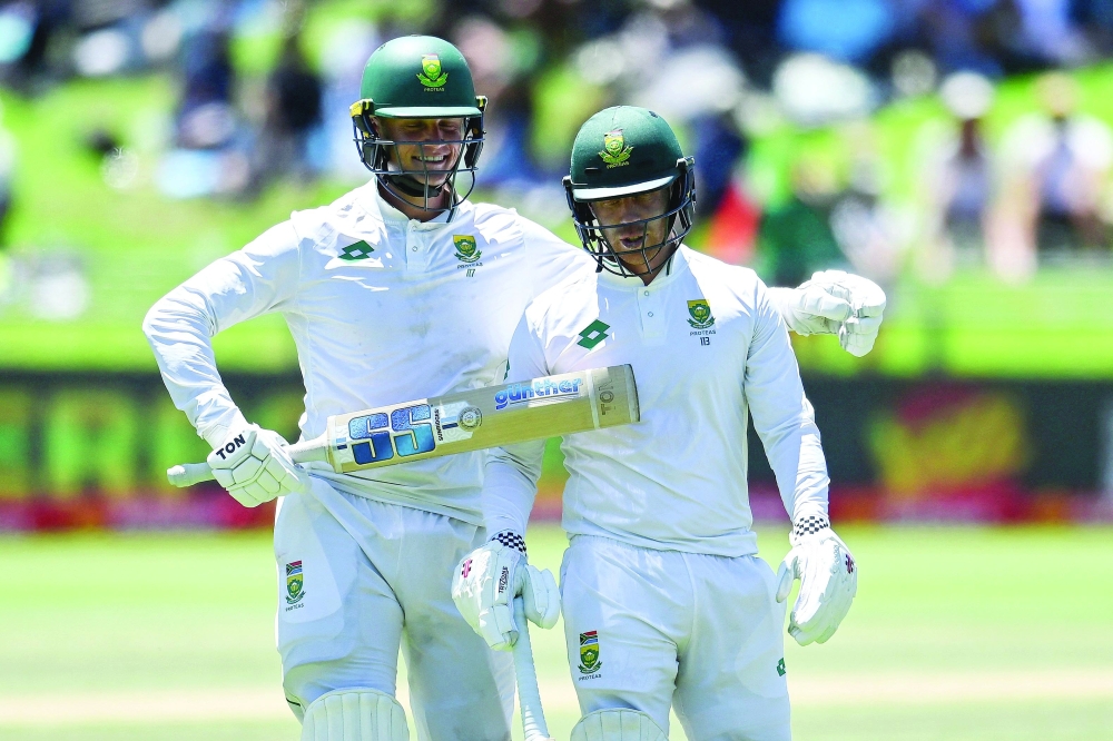 TOPSHOT — South Africa's Kyle Verreynne (R) walks back to the pavilion after his dismissal by Pakistan's Salman Agha (unseen) as South Africa's Ryan Rickelton (L) puts his arm around his shoulder during the second day of the second international Test cricket match between South Africa and Pakistan at Newlands stadium in Cape Town on January 4, 2025. ALTERNATE CROP
 (Photo by Rodger Bosch / AFP) / ALTERNATE CROP