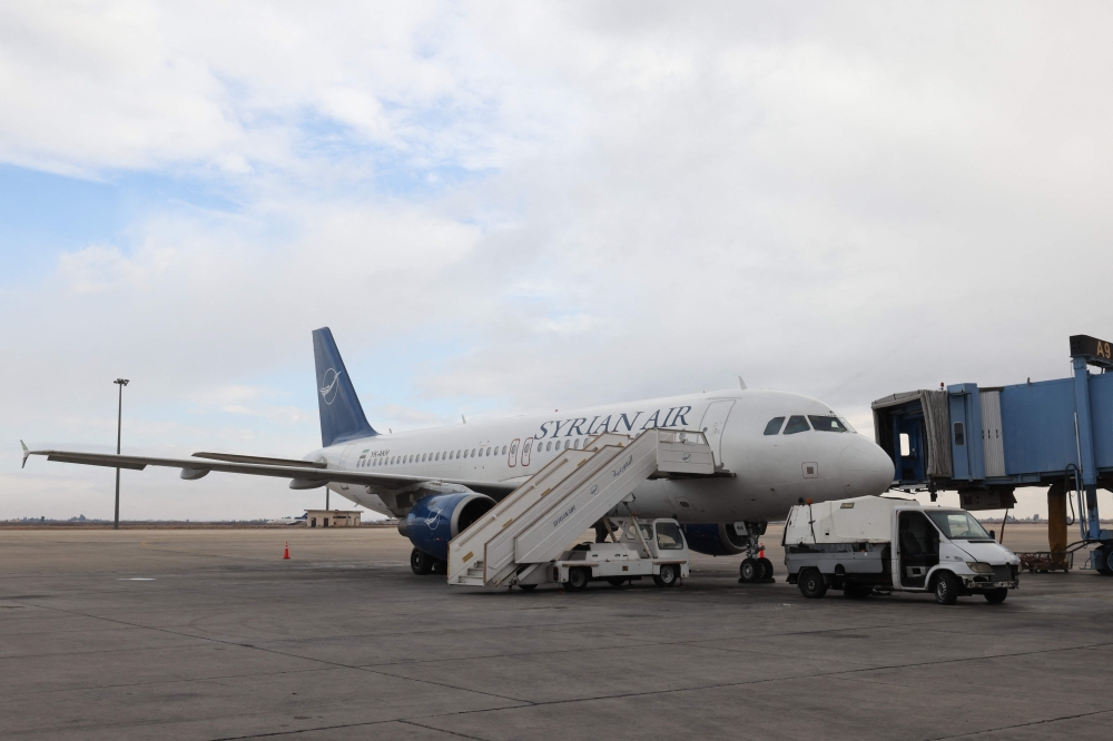 A plane is parked on the tarmac at Damascus International Airport 