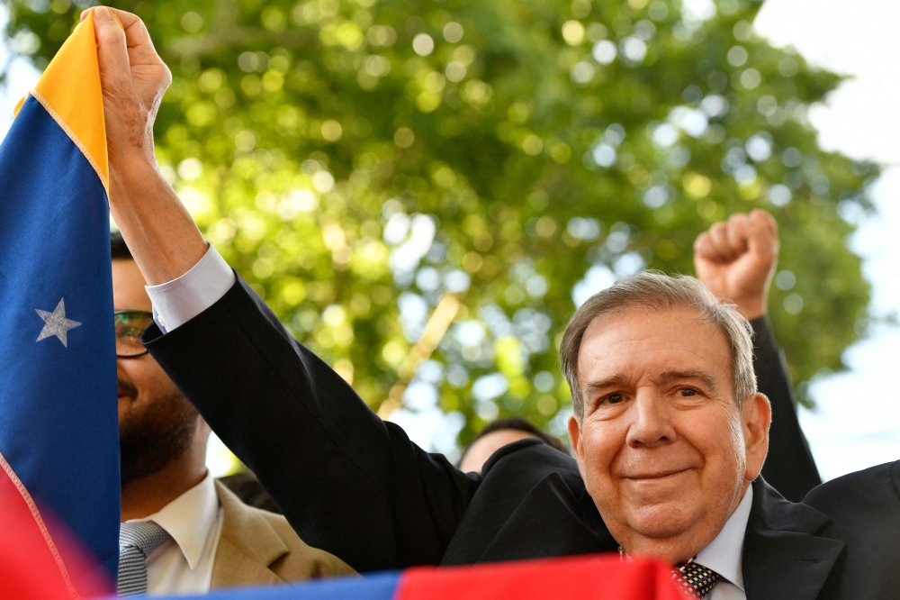 Venezuelan opposition leader Edmundo Gonzalez Urrutia holds a Venezuelan flag, in Montevideo. — AFP 