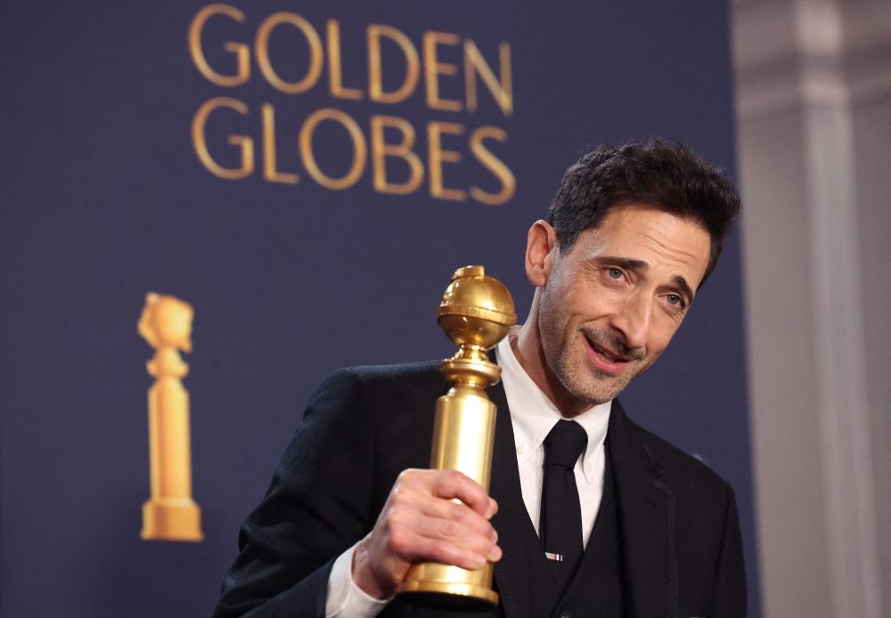 Adrien Brody, winner of Best Performance by a Male Actor in a Motion Picture - Drama for "The Brutalist" poses at the 82nd Golden Globe Awards in Beverly Hills, California, U.S., January 5, 2025. REUTERS/Mario Anzuoni
