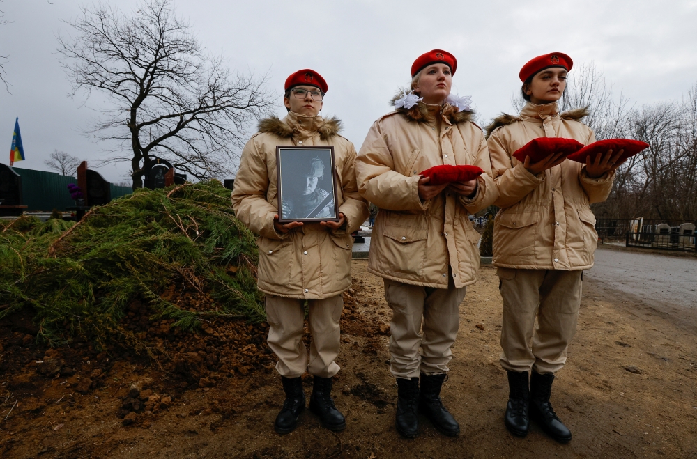 Participants line up during the funeral for Alexander Martemyanov killed in a drone strike in Donetsk. — Reuters 